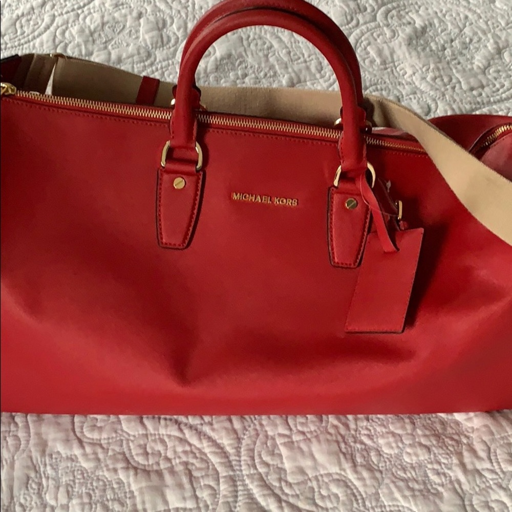 Michael Kors small red duffle bag